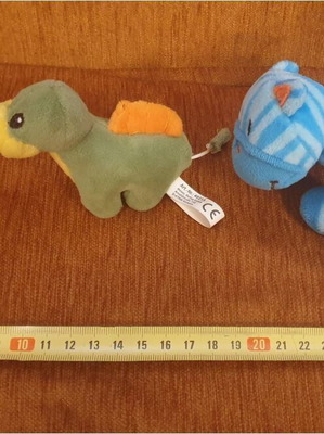 Two small plush toys with vibrating tails like new