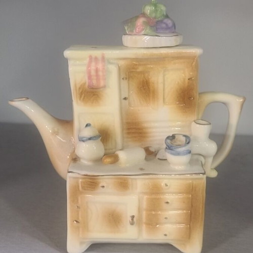 Porcelain vintage teapot used, height 15cm