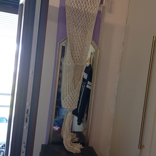 Two knitted wall hangers for pots, different sizes