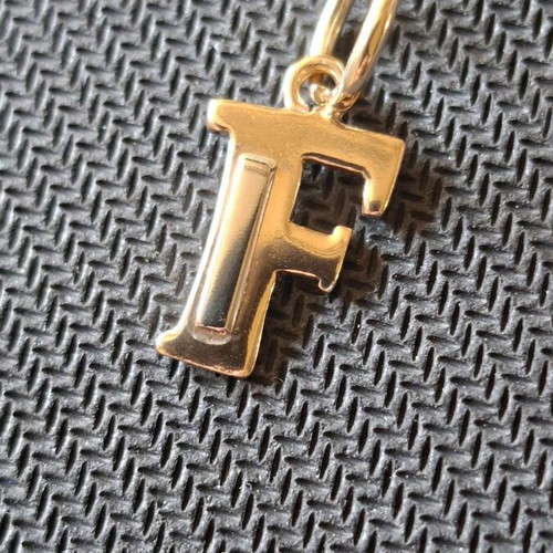 Gold monogram 14 carat like new, 3×1.5 cm, 1.97 grams