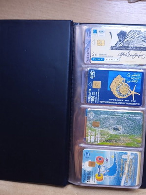 Phone cards like new, set of 48 in album 1
