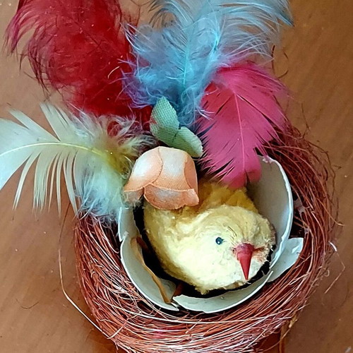 Vintage Easter nest used with yellow chick and colorful feathers