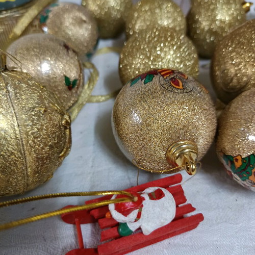 Christmas decorations like new, assorted ornaments and ribbon