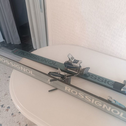 Rossignol STS Fibroplastic skis used with Tyrolia 260 bindings, Skitique poles, and Solomon SX81 325 boots