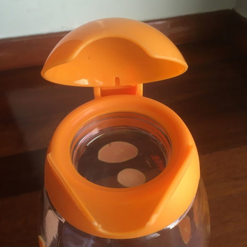 Solmazer jug like new with orange pattern and plastic lid