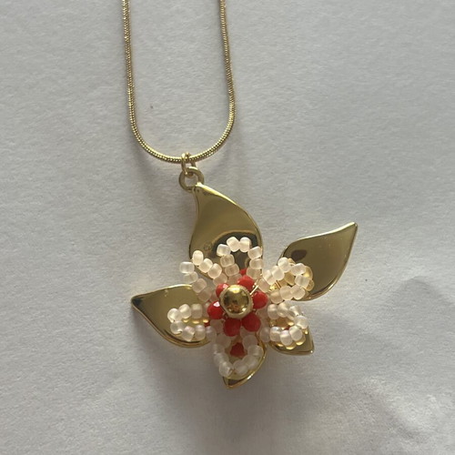 Necklace new, gold color with flower pendant