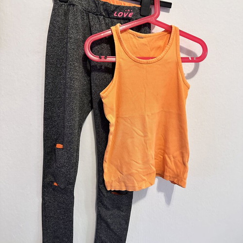 Girls' sports set with grey leggings and orange tank top, size 10