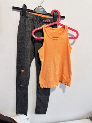 Girls' sports set with grey leggings and orange tank top, size 10