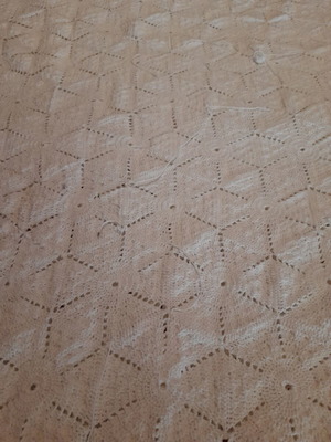 Handmade white crochet blanket in vintage style