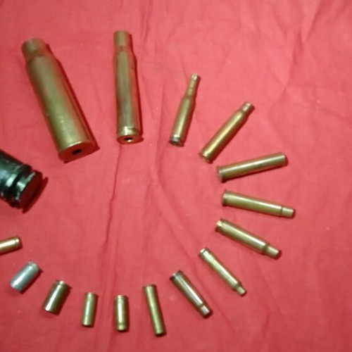 Empty deactivated cartridge cases used, various calibers including M-230 from AH-64 Apache