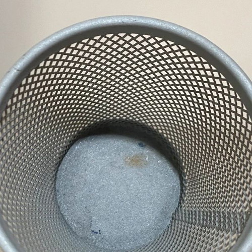 Gray pencil holders used with wear on inner bottom