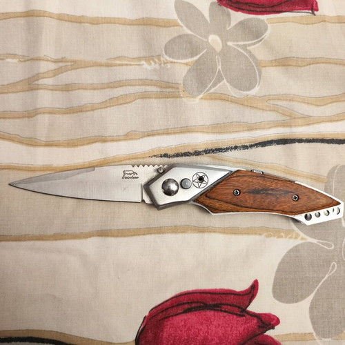 Decorative steel knife like new with button and safety lock