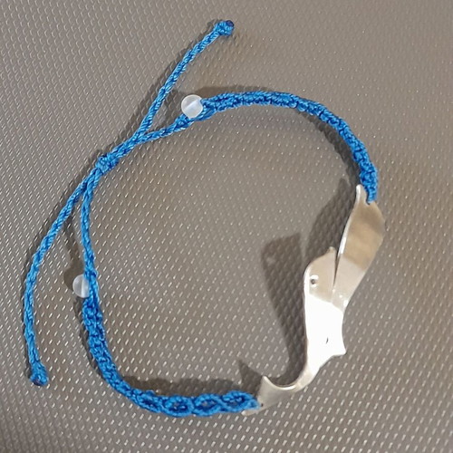Handmade silver macrame bracelet with silver dolphins and colorfast threads