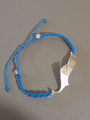 Handmade silver macrame bracelet with silver dolphins and colorfast threads