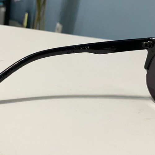 Sunglasses used with black frame and round shape