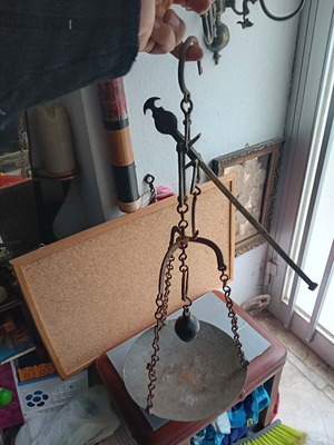 Old balance scale used with copper pan and bronze rod