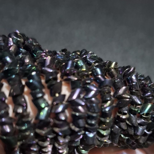 Torsade necklace used with iridescent carnival glass beads, 50cm