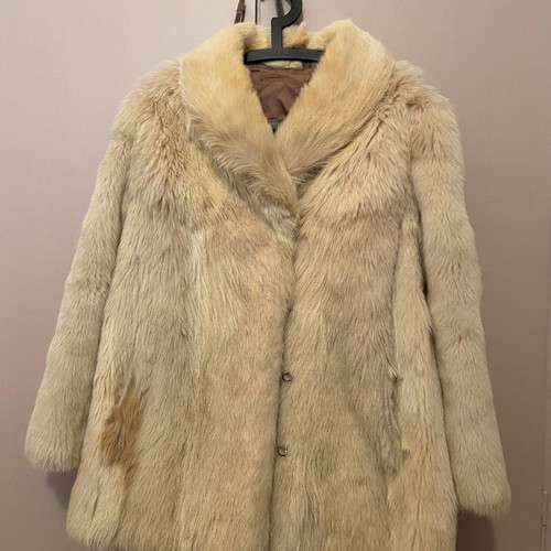 Genuine fur used, ecru with some brown spots