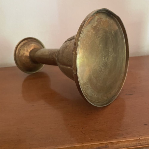 Handmade antique candlestick over 100 years old, brass with hammered details, used