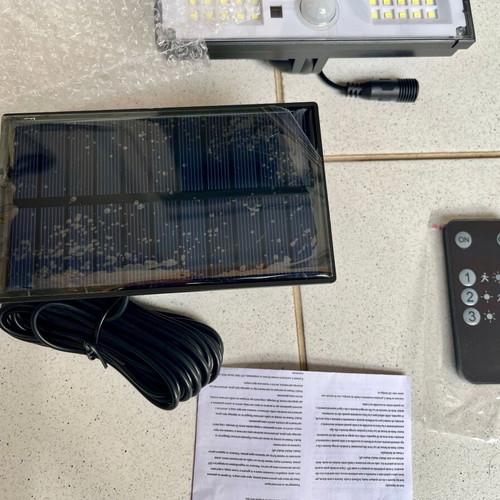 Solar LED Floodlight with Remote Control and Motion Sensor, New