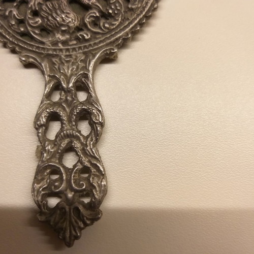 Carved old hand mirror used