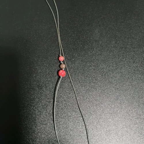 Long necklace like new, gold color with brown cord