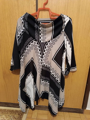 Shirt with various patterns like new, size medium, black and beige