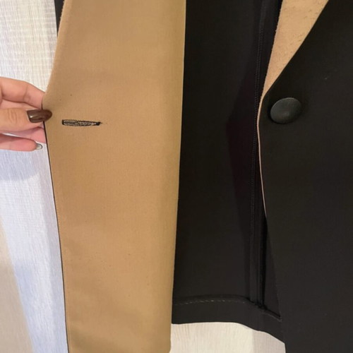 Sleeveless jacket used, black and tan, size small