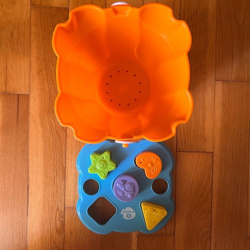 Beach bucket with shape sorting toy used