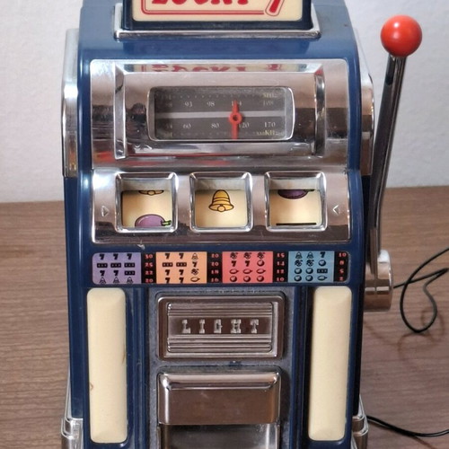 Marksman Las Vegas Lucky 7 AM/FM radio used, one armed bandit slot machine