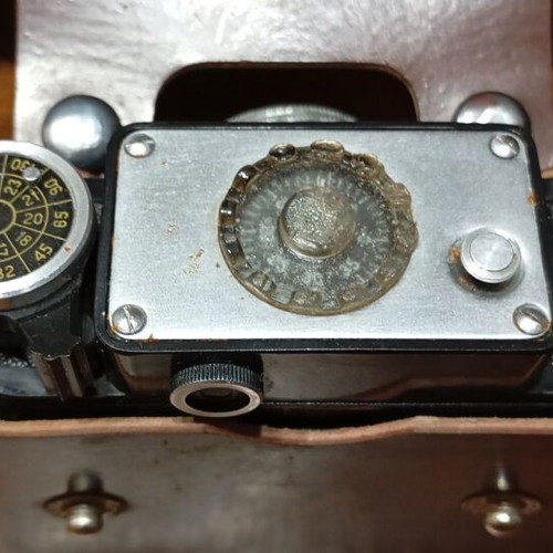 Retro Smena-4 camera used with leather case and tripod mount