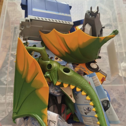 Playmobil box with helicopter, dragon, school bus, garbage truck and more