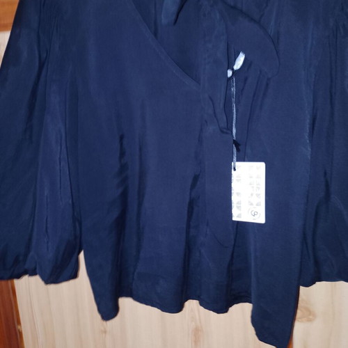 Elegant blouse with bow on back, new