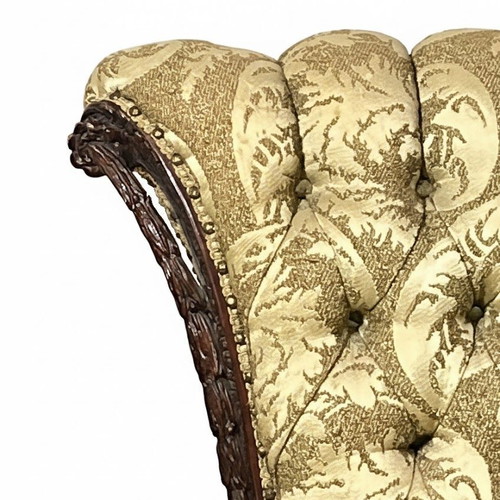 Hollywood Regency tufted armchairs used, mahogany carvings, set of two
