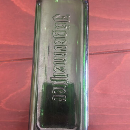 Jagermeister collectible bottle used, empty with Light & Hawk label