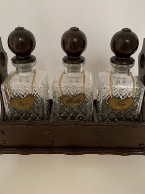 Drink bottles in rolling stand, set of three, like new