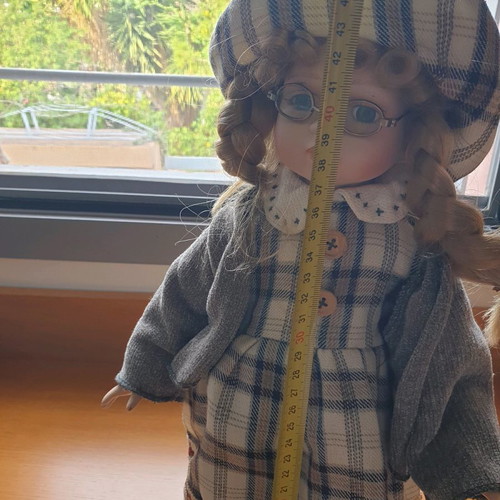 Porcelain dolls new with handmade clothes and support base