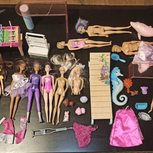 Barbie and other toys used, in moderate condition
