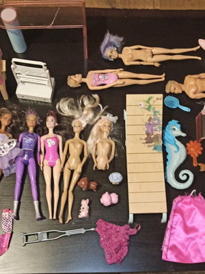 Barbie and other toys used, in moderate condition