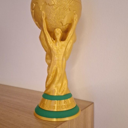 FIFA World Cup Trophy replica in gold color with green base details