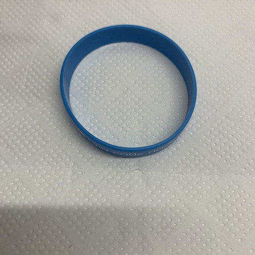 Unicef bracelet new, blue rubber with message