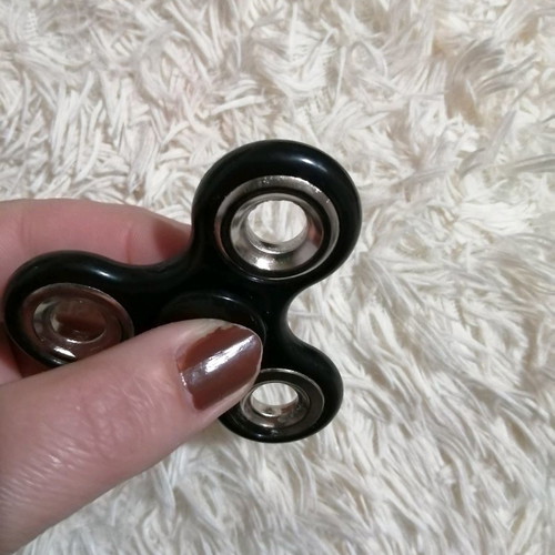 Fidget spinner used, 7.5 x 5.5 cm