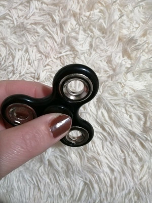 Fidget spinner used, 7.5 x 5.5 cm