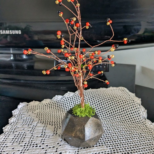 Decorative handmade tree with plaster base and painted details