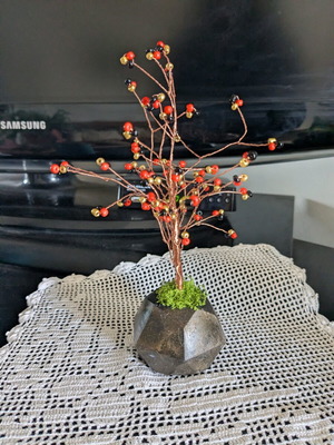 Decorative handmade tree with plaster base and painted details