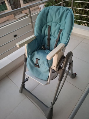 Prenatal high chair used, blue with rear wheels