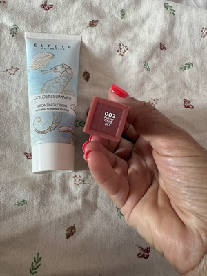 Elfeya Golden Summer bronzing lotion and Revlon lipstick