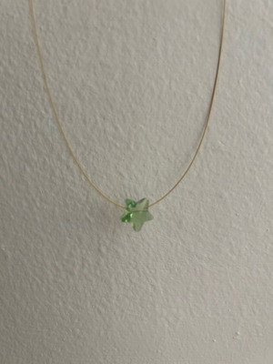 Bizart necklace with green star like new