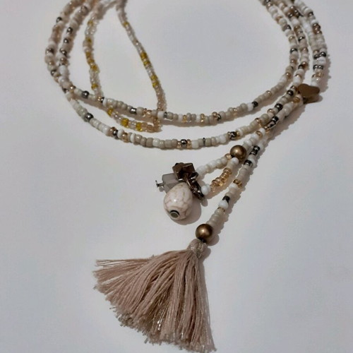 Long beaded necklace new in white and gold shades with tassel