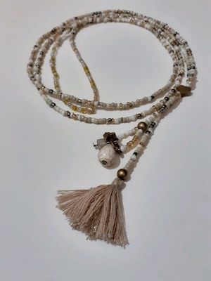 Long beaded necklace new in white and gold shades with tassel